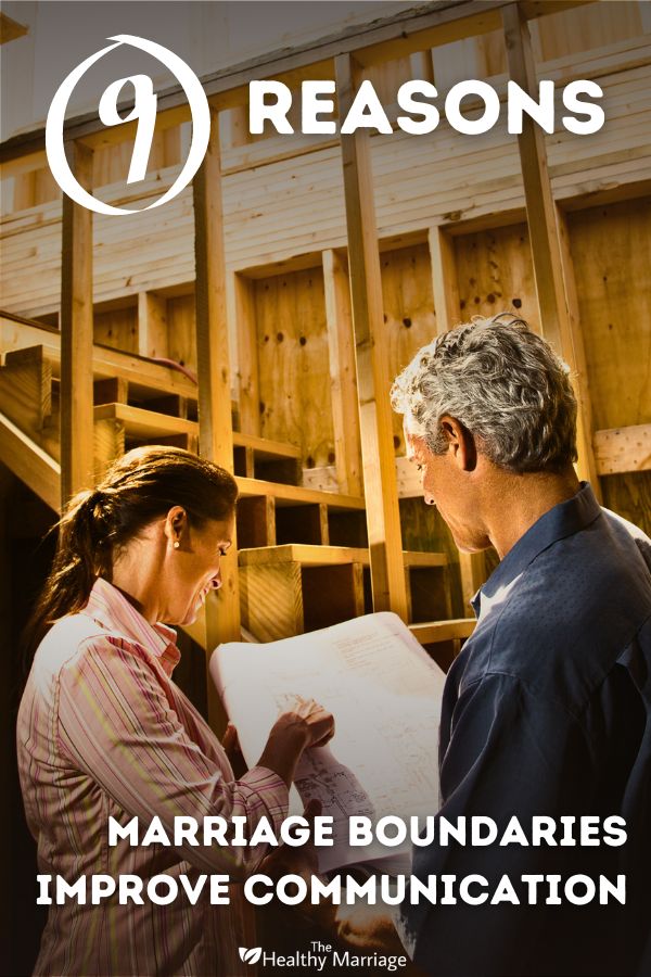 Couple looking at framework of their new house